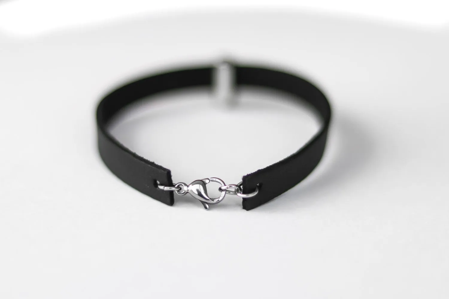 Skull bracelet for men with a black faux leather cuff strap, custom size