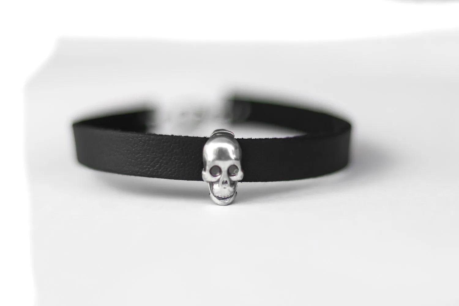 Skull bracelet for men with a black faux leather cuff strap, custom size