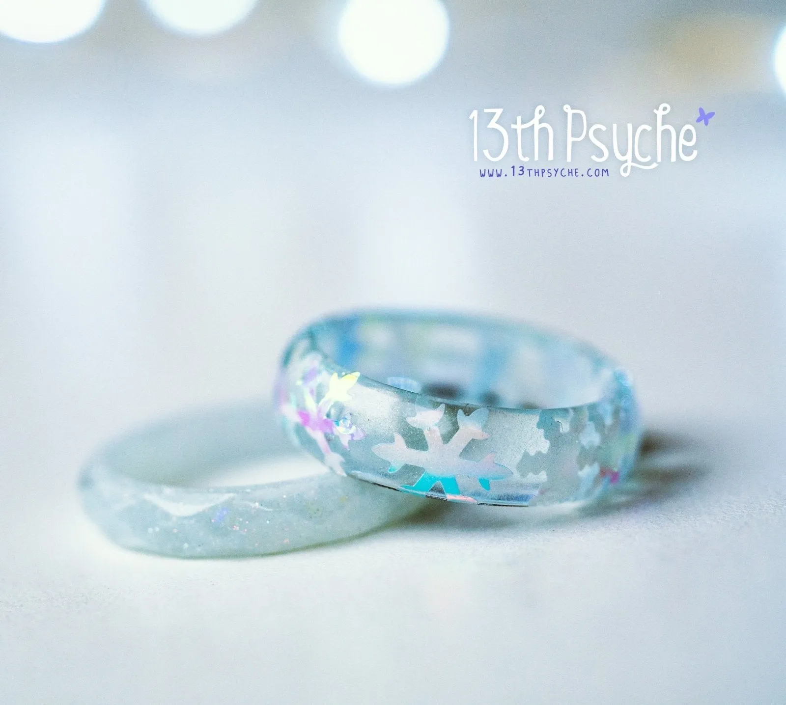 Winter inspired snowflake and white glitter resin ring set of two